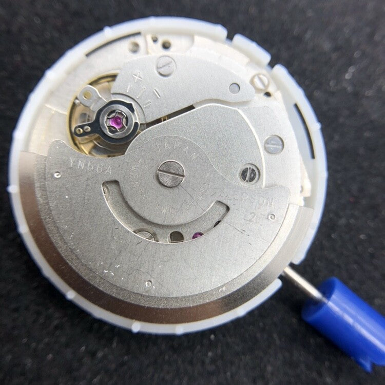 Epson YN56 mechanical watch movement showing date and day display for accurate time.