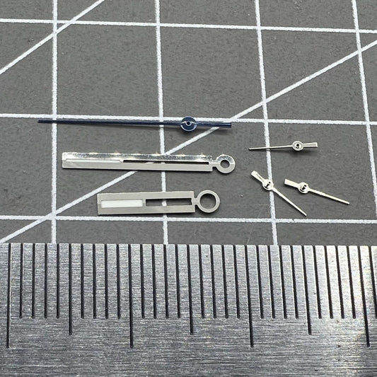 Luminous silver watch hands for Ronda 5021D quartz movement, ideal for precise timekeeping in watch repairs.