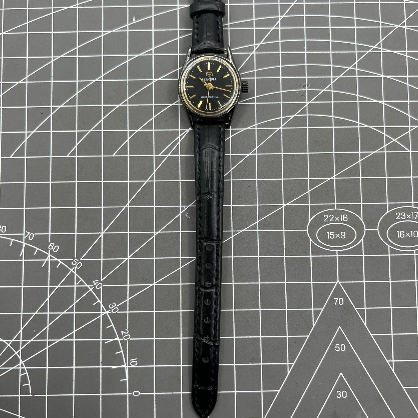27mm Tianjin Seagull ladies watch with manual movement and gold nail markers in elegant design.