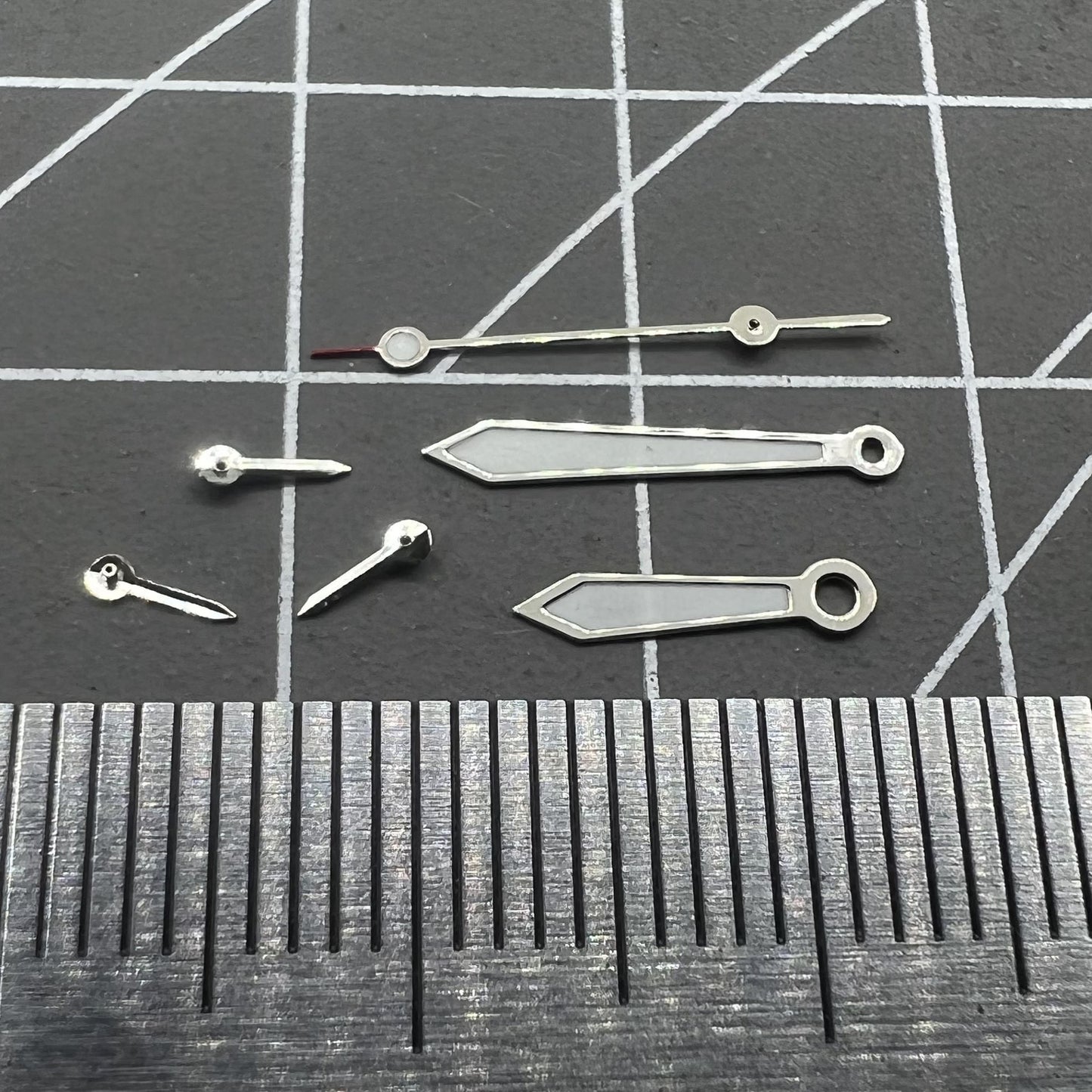 Arrow-shaped 13mm green lume watch hands with silver trim for VD53 VD54 VD57 movements.