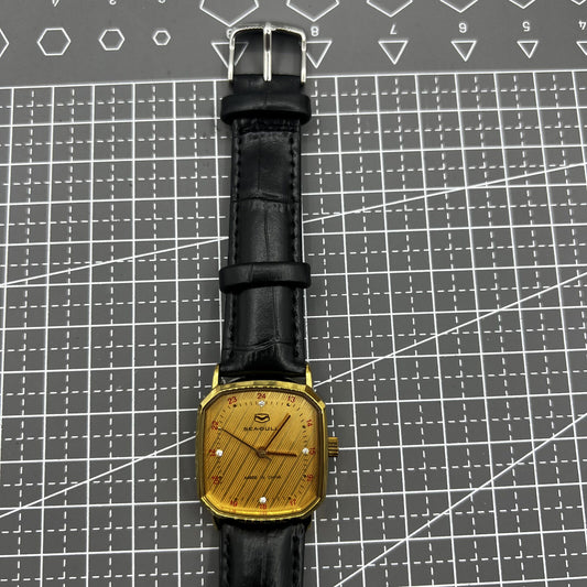 Tianjin Seagull 28mm octagonal gold case watch with golden dial, manual mechanical movement craftsmanship.