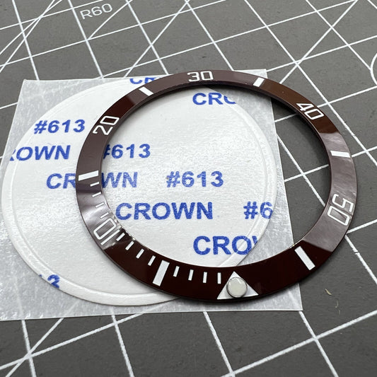 38mm green ceramic luminous watch bezel with brown slope ring and silver font.