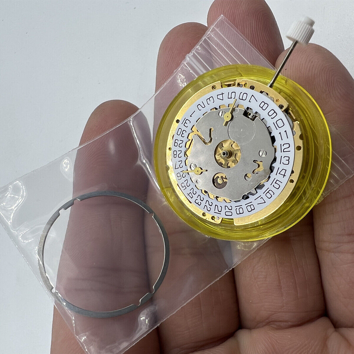 ISA 8161 golden watch part with Swiss quartz movement and three hands for accurate timekeeping.