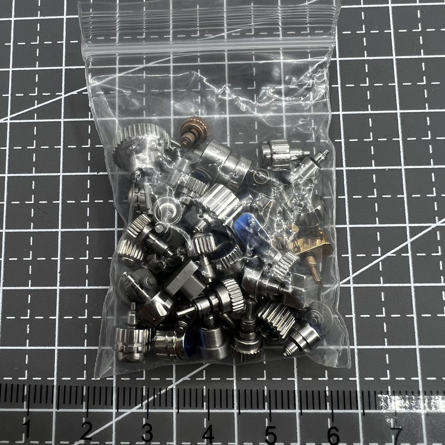Assorted watch push buttons pack, 50 pieces, perfect for Timex watch repair and replacements.