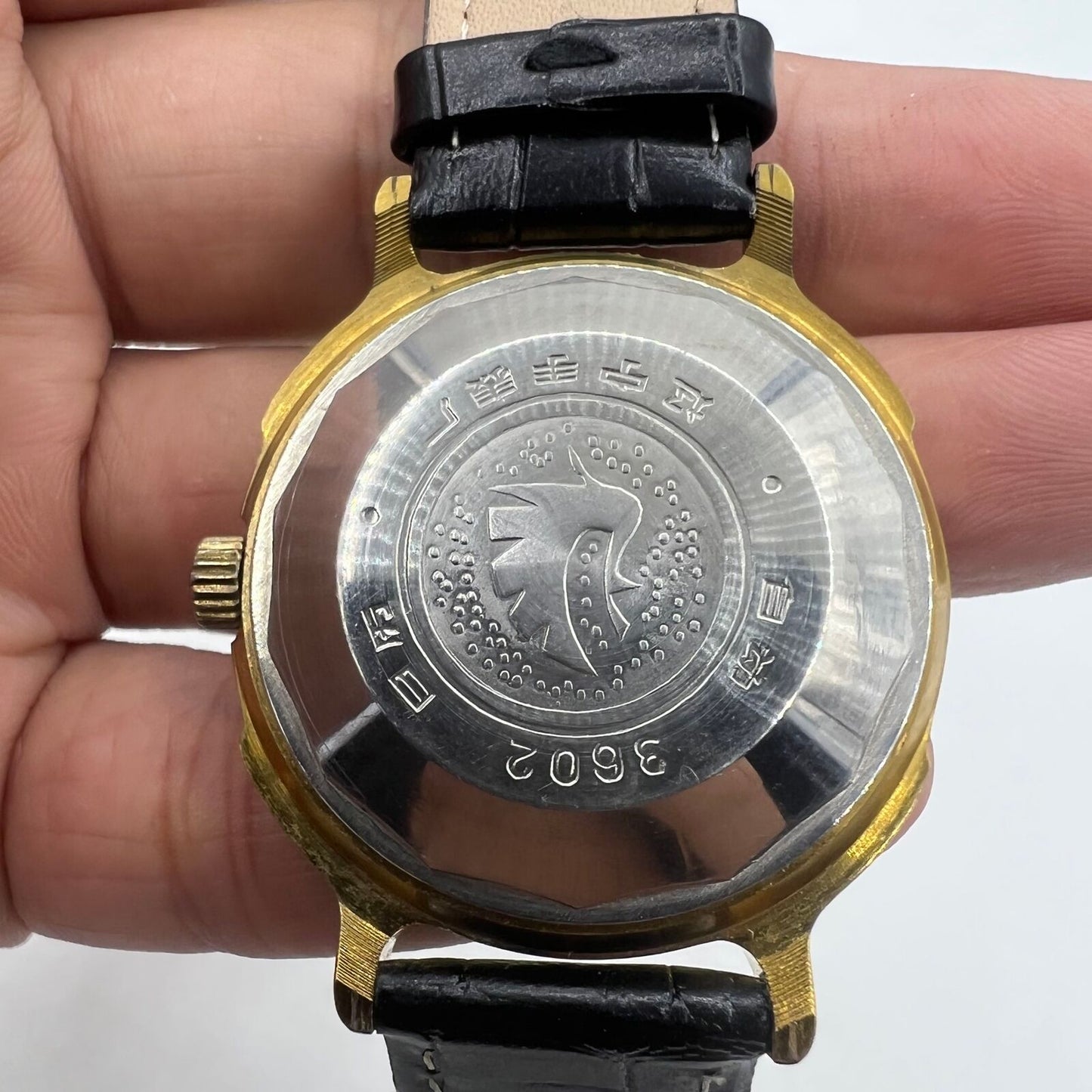 37mm automatic watch with black dial, golden Roman numerals, 33 jewels for elegant wear.