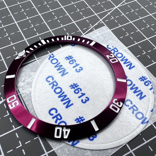 38mm ceramic watch bezel with red slope ring, silver font, and green luminous details for stylish timepieces.