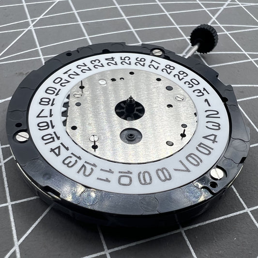 Miyota 6S10 quartz watch movement with small second hands at 6, 9, 12 o'clock positions and date at 3.