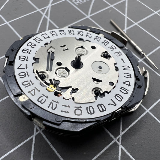 Hattori Epson TMI YM85A quartz watch movement, Japan-made precision for watch repair.