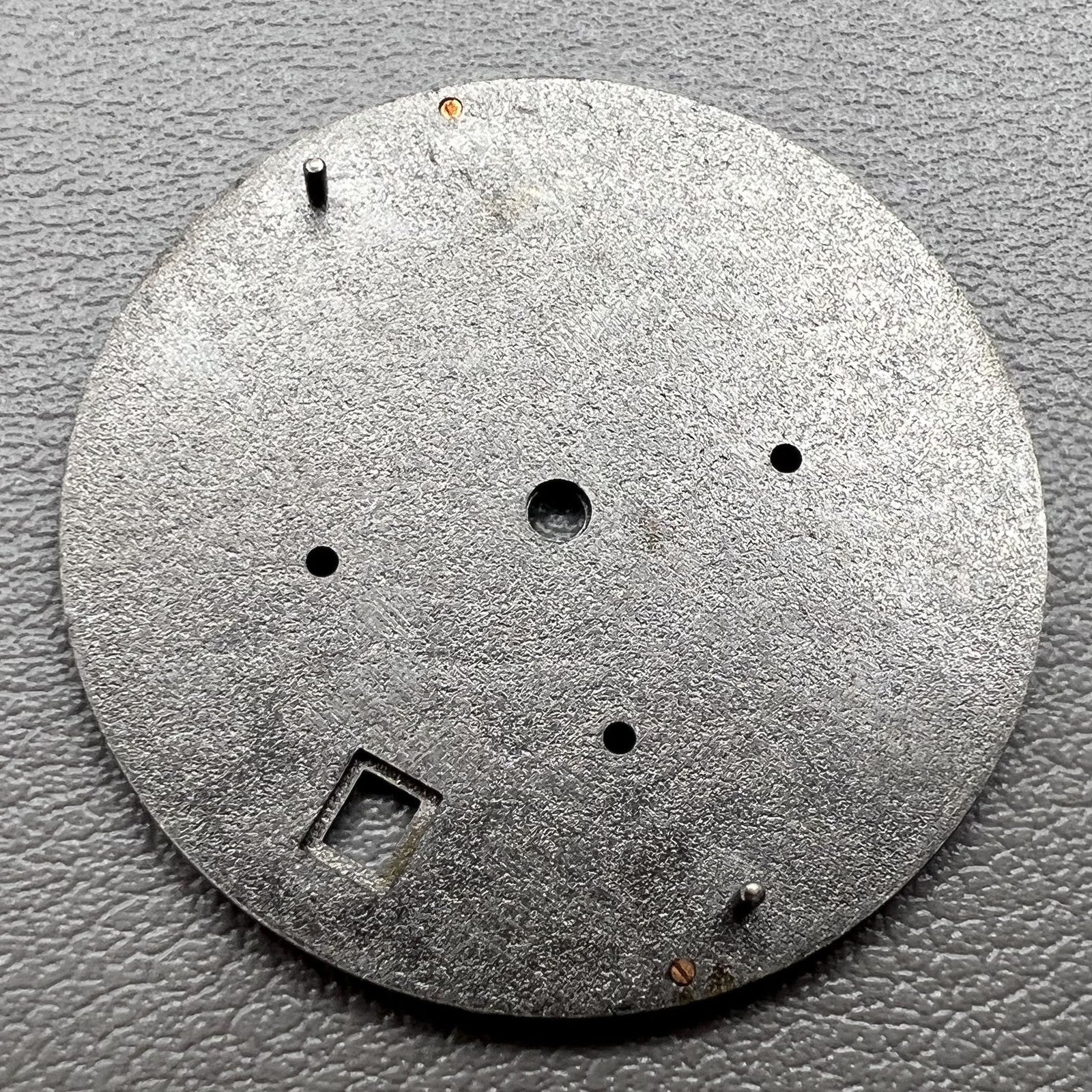 Green luminous watch dial with 31mm silver trim for VD53 movement, ideal for precise watch repairs.