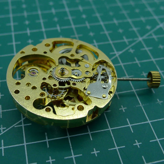 Golden 26.5mm DANDONG 7120 automatic mechanical watch movement with hollow design, precise craftsmanship.