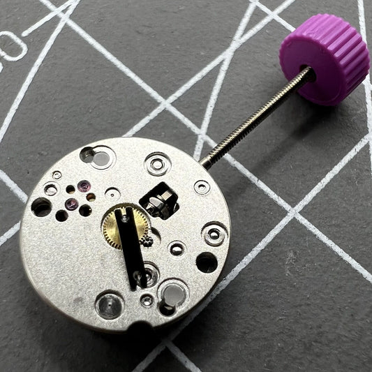 Ronda 1042 quartz watch movement with two hands, precise timekeeping for watch repairs.