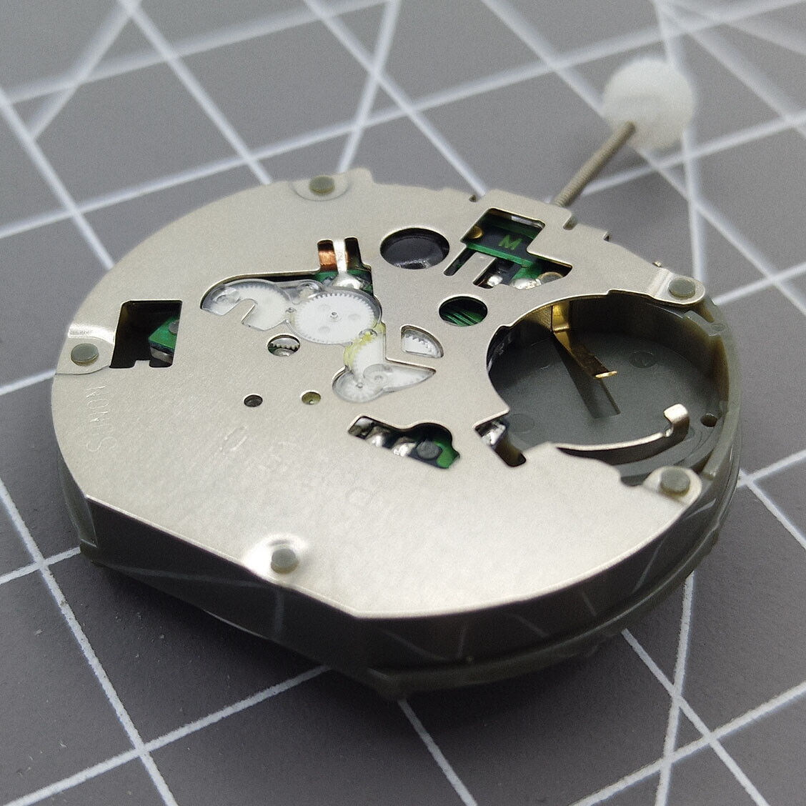 Sunon PE50 quartz watch with three hands, date at 3 o'clock, and small seconds subdials at 2, 6, and 10.