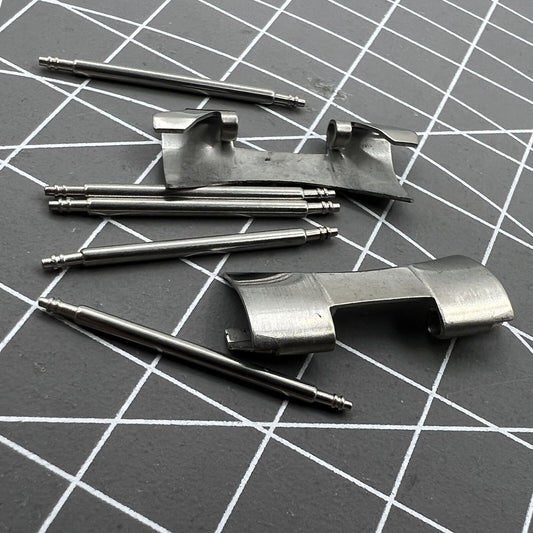 22X9mm stainless steel curved end links with spring bars for secure watch band attachment.