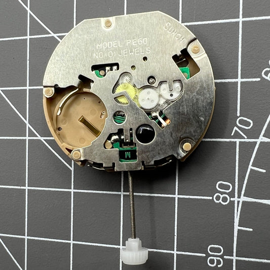 Sunon PE60 watch with three hands, date at 3, small seconds at 3, 6, and 9, quartz movement, sleek design.