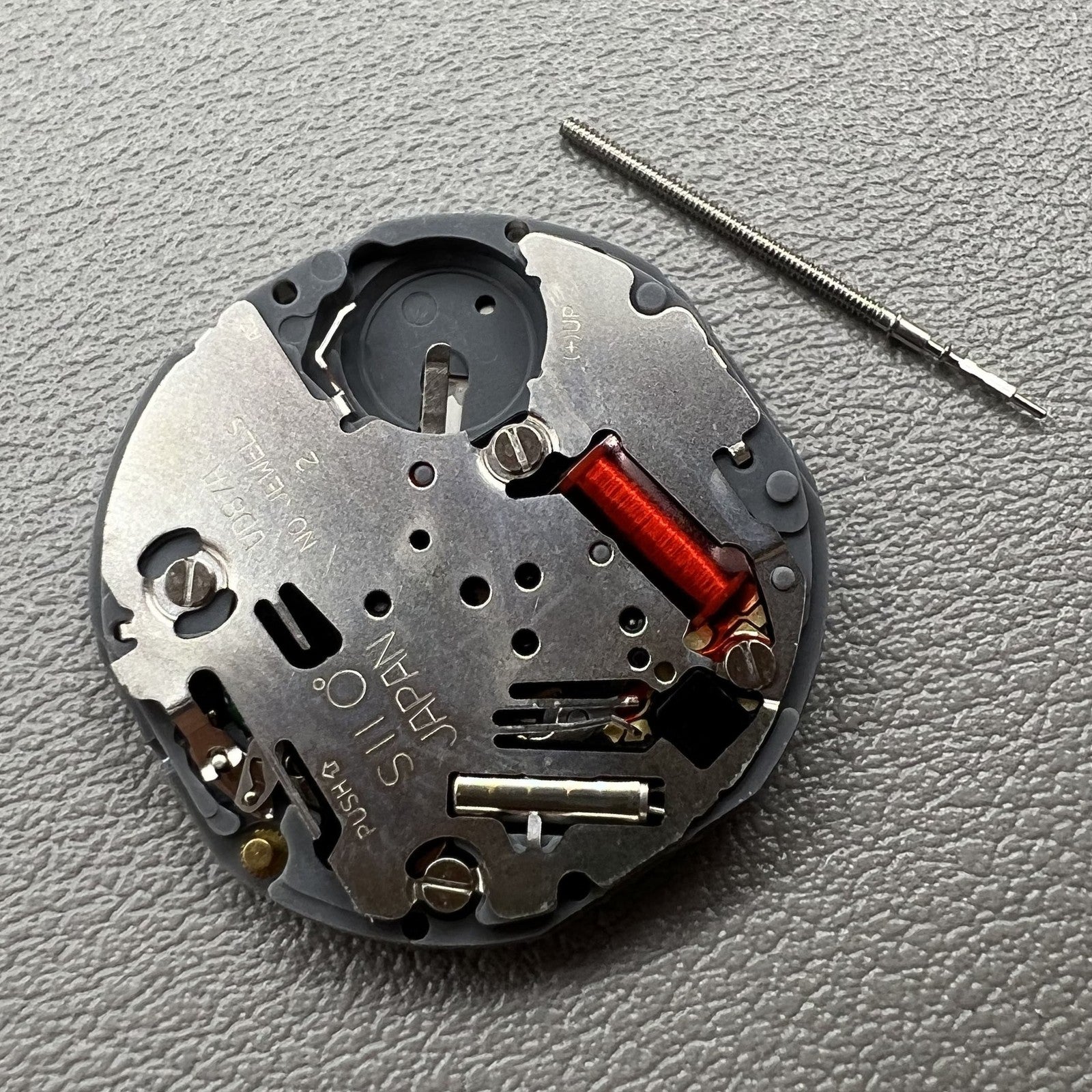 Japan Hattori Epson VD87A quartz watch movement showcasing precision engineering for reliable timekeeping.