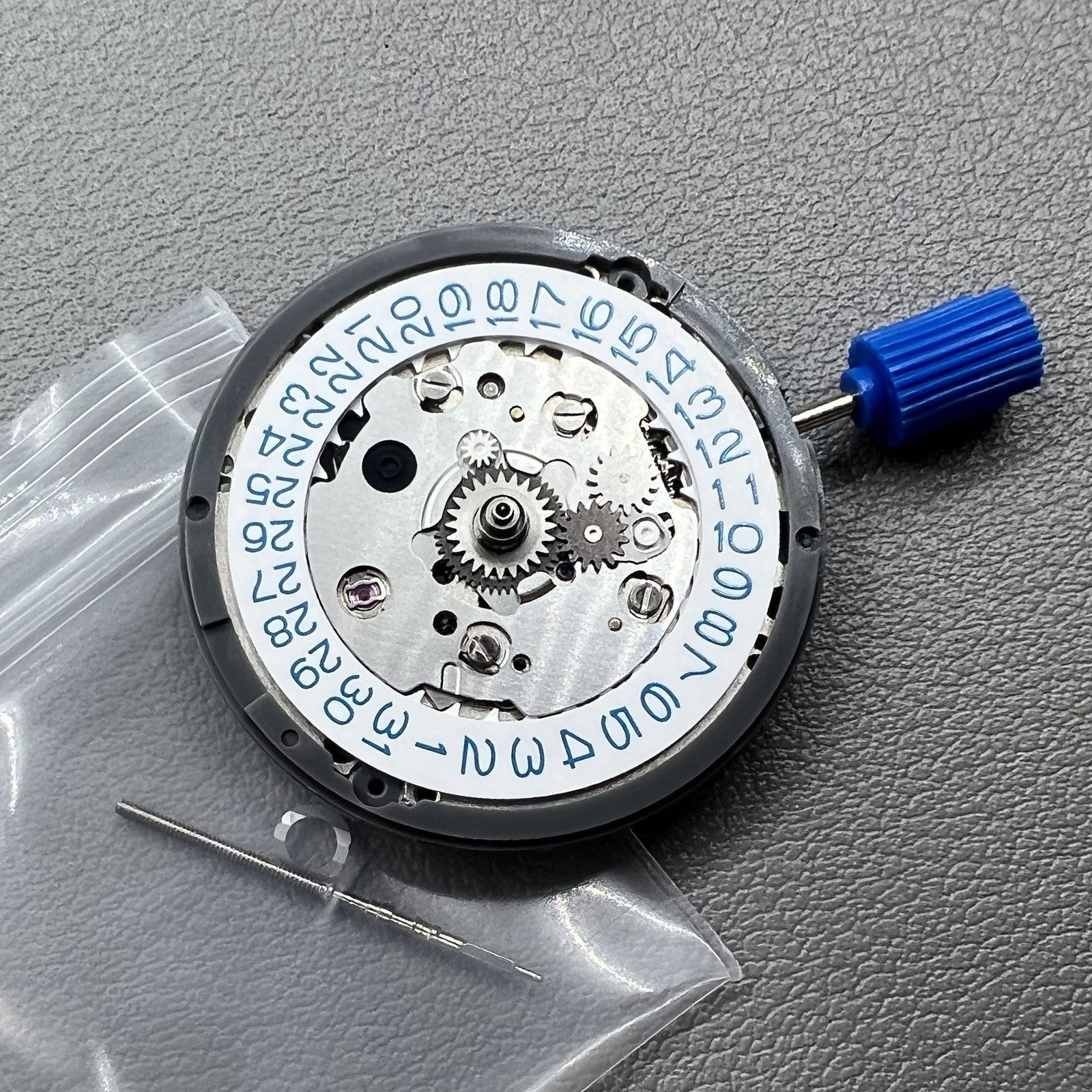 Seiko NH34 automatic GMT watch movement showing hacking seconds for accurate timekeeping.