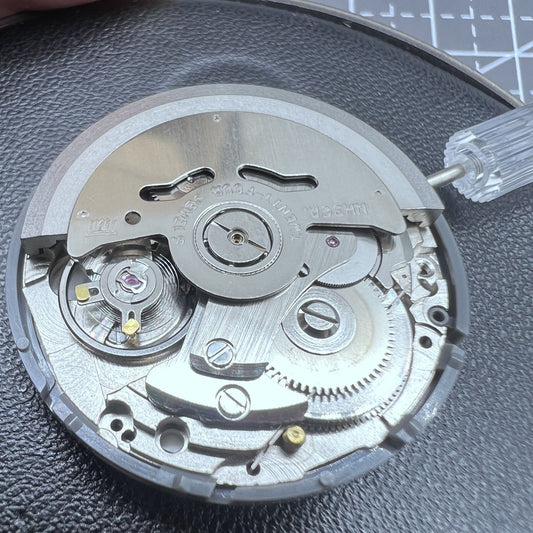 Seiko NH36 automatic watch with Arabic date dial and crown positioned at 3.8, classic design.