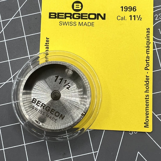 Bergeon 1996-11 adjustable watch movement holder with hollow center screw for precision repair.