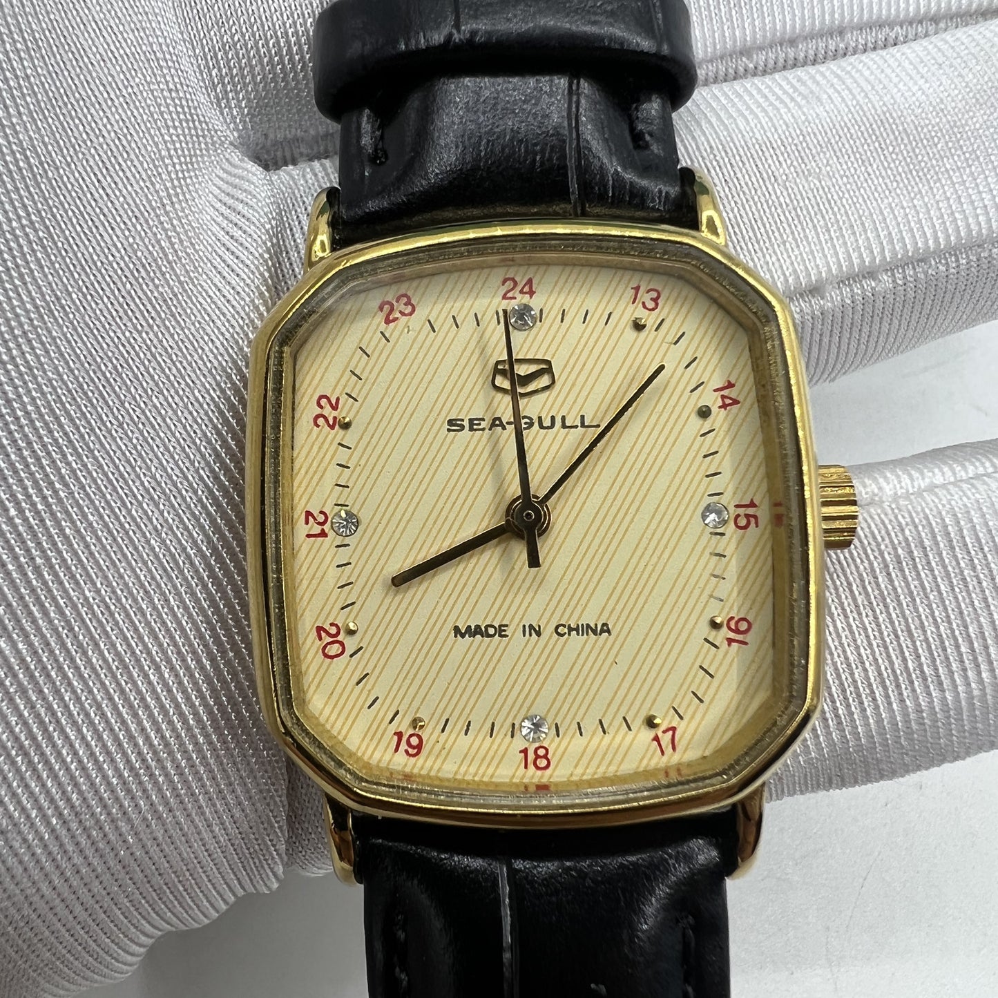 Seagull 28mm ladies watch featuring a golden square case and manual mechanical movement, stylish and elegant design.