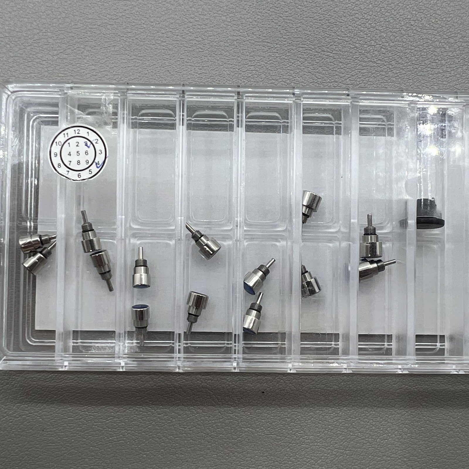 Silver stainless steel watch accessories set, 14 pieces in 7 sizes, classic pusher design for repairs.