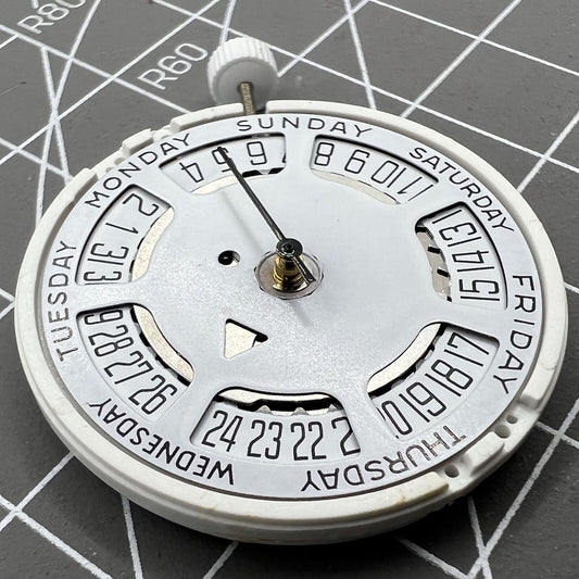 ISA 1198 quartz watch movement with day-date function and white dial, date at 6 o'clock, replacement part.