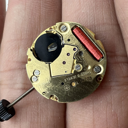 ETA F03.115 Swiss quartz watch movement with 3 hands and date display at 3/6 position.