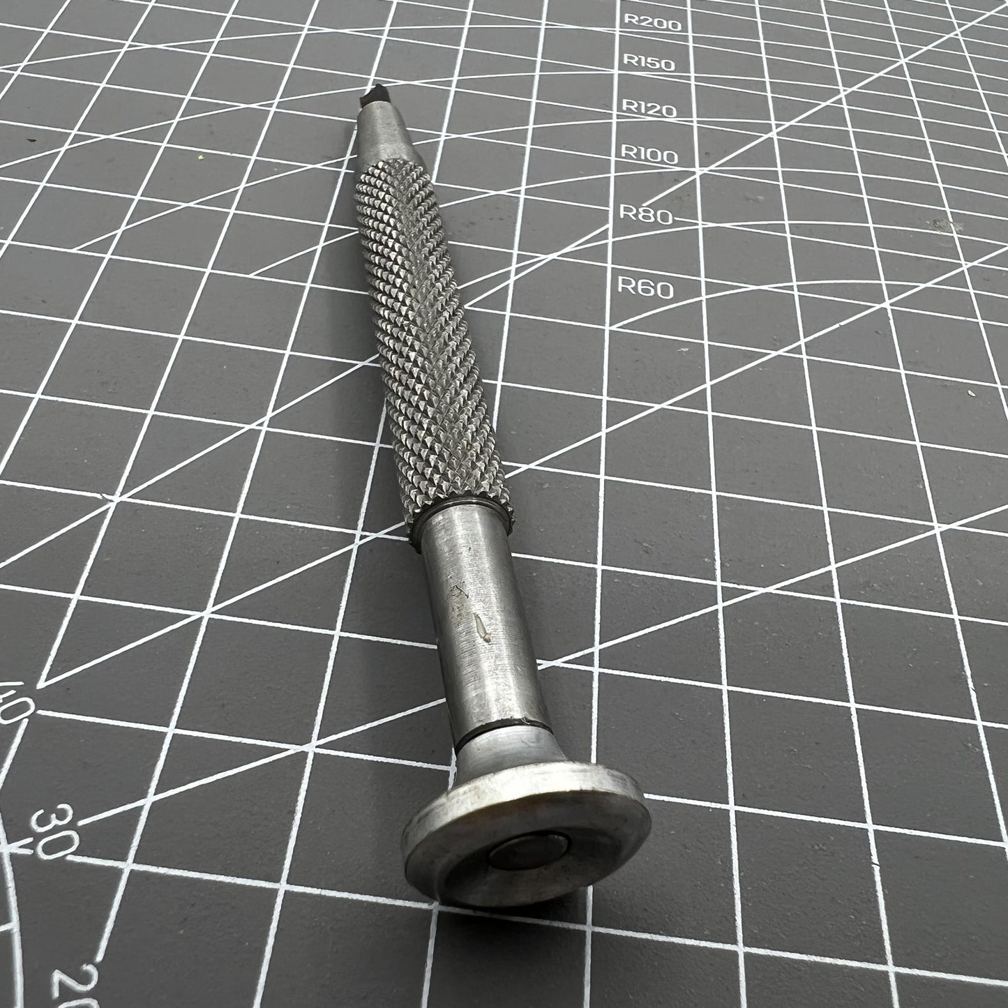 Precision watch remover tool with oscillating weight rotor for Citizen 6651A 6601 repair.