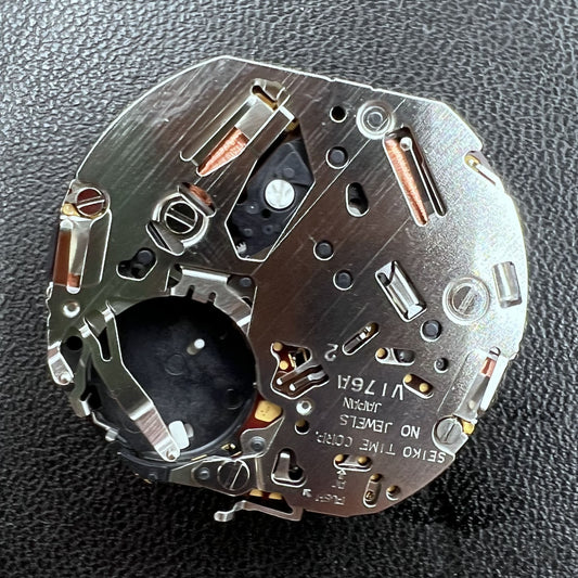 Seiko V176A quartz movement close-up, original Japanese watch accessory for precise timekeeping.