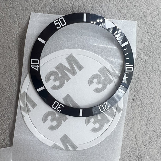 Ceramic black 37.5mm SUB watch bezel with white font, no lume, slope design.