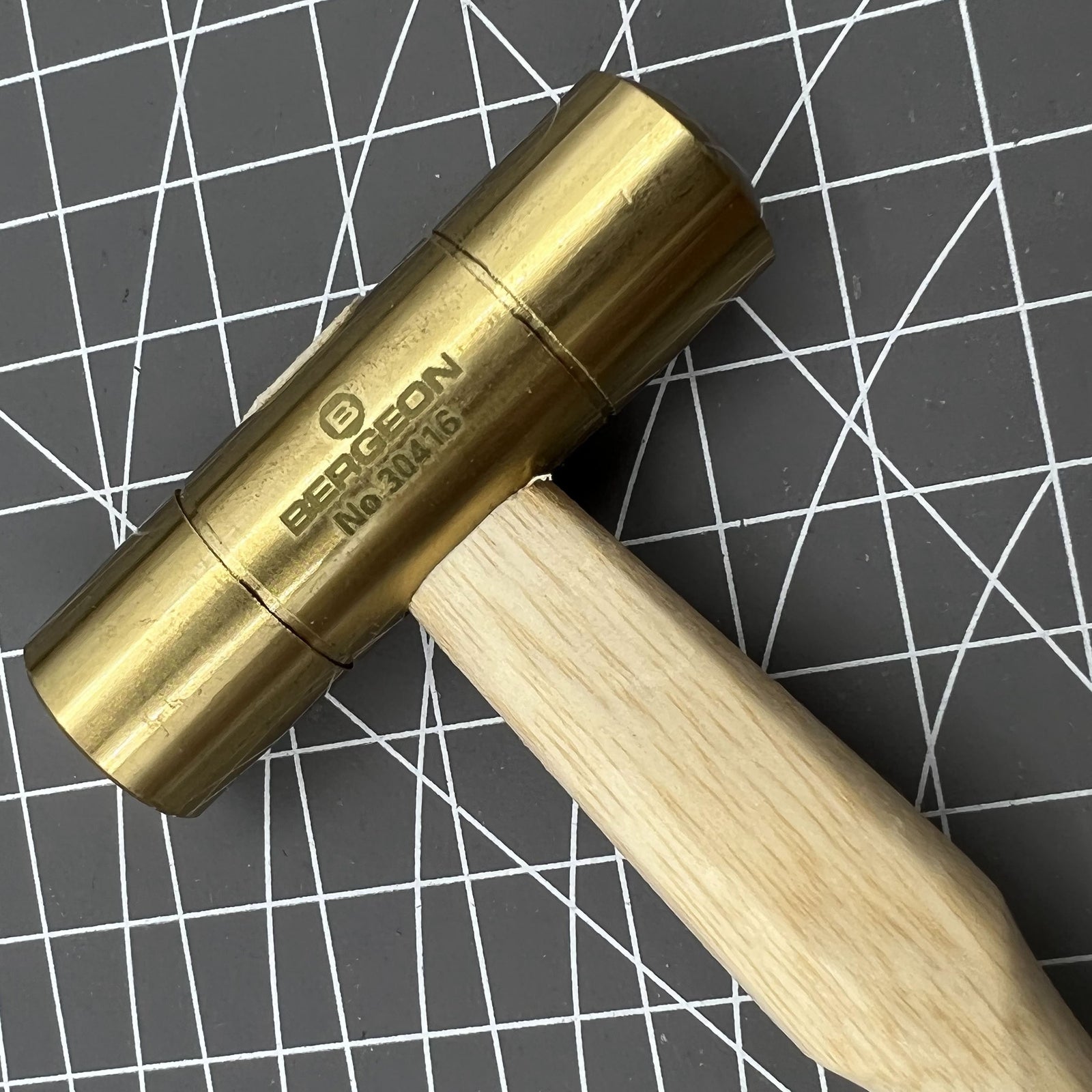 Swiss Made Bergeon 30416 brass hammer set for precise watch accessory repairs and adjustments.