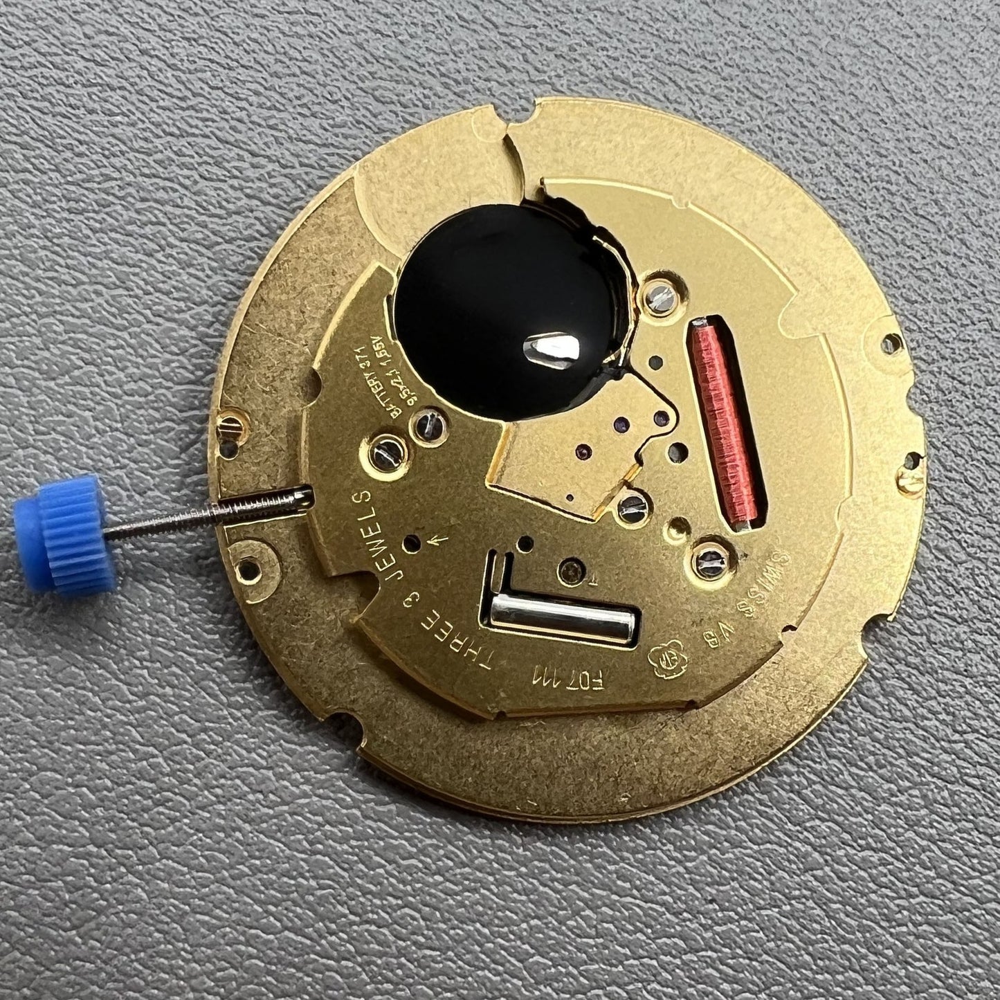 Swiss ETA F07.111 quartz watch movement with black dial and date display at 6 o'clock by ETA brand