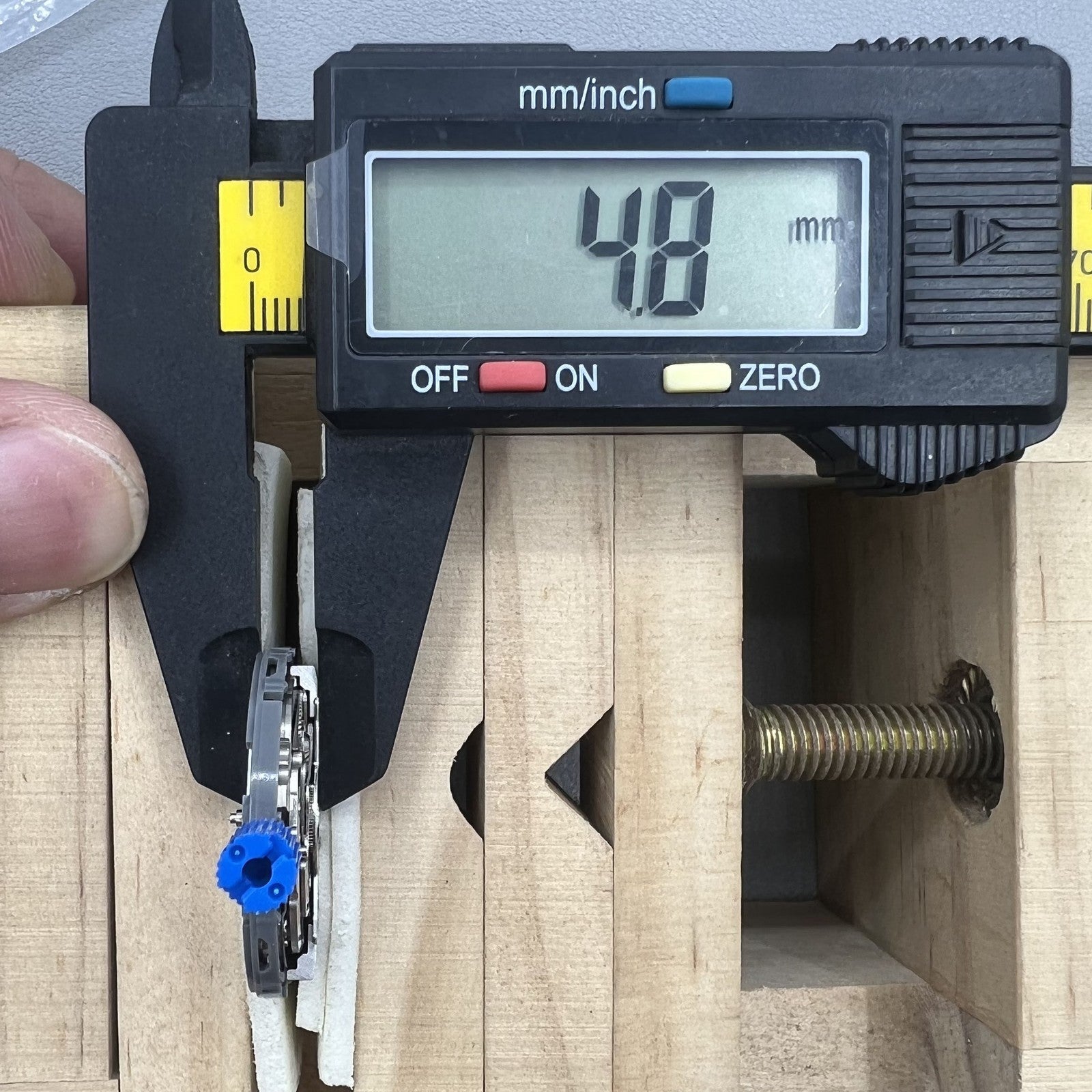 Seiko NH34 automatic GMT watch movement showcasing hacking seconds for accurate timekeeping.