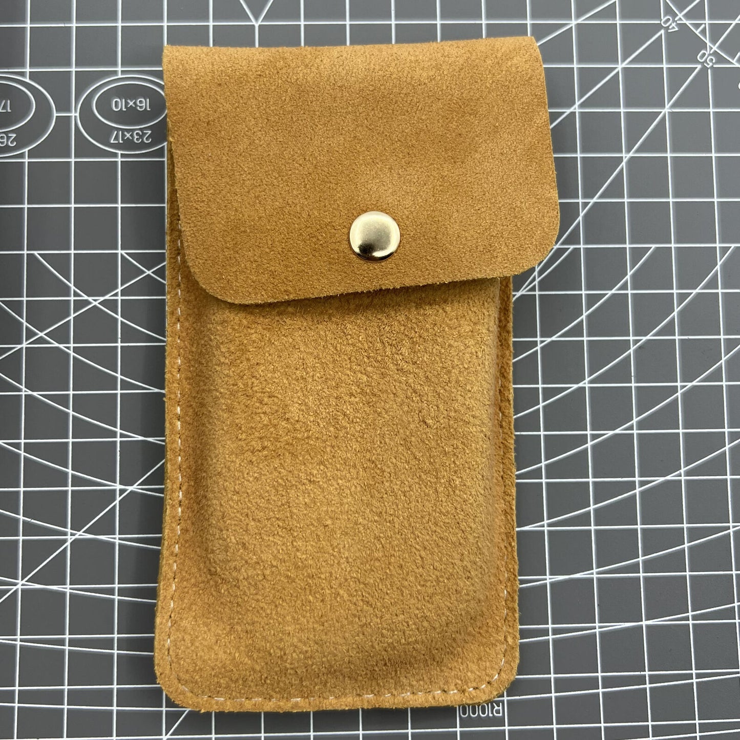 Brown Cowhide single watch storage pouch with soft lining, protective travel case for watches.
