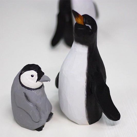 Handmade Emperor Penguin mother and baby wooden figurine sculpture, perfect decorative piece for home.