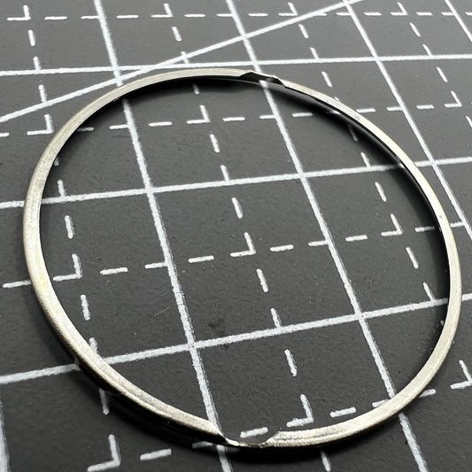 Steel watch case cushion mount spacer ring for SW200/220/240 movements, enhancing durability and fit.