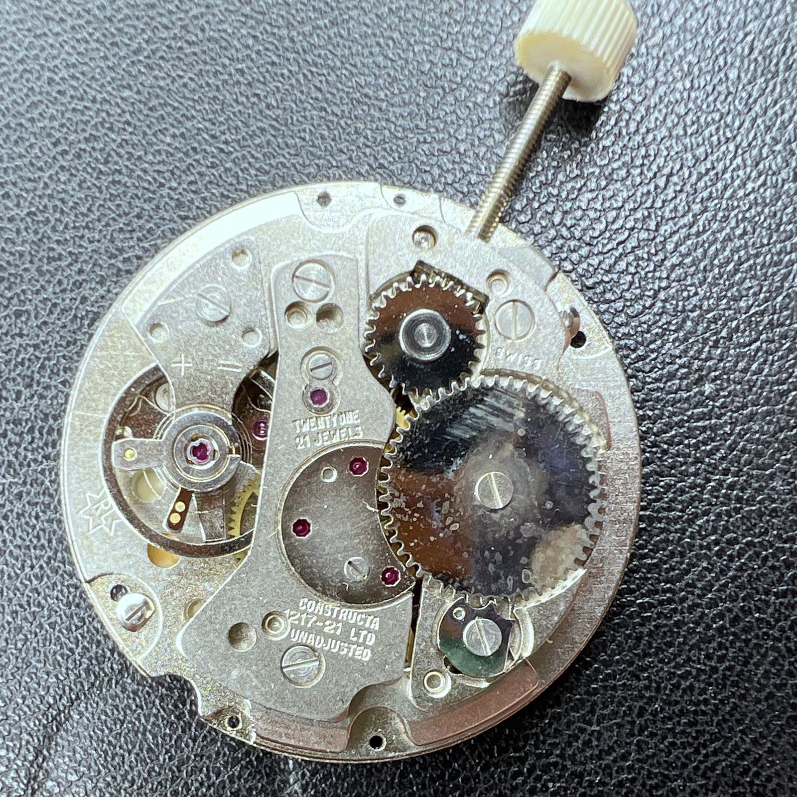 Swiss RONDA MATIC 1217-21 manual winding watch movement showing detailed gears and components for repair.