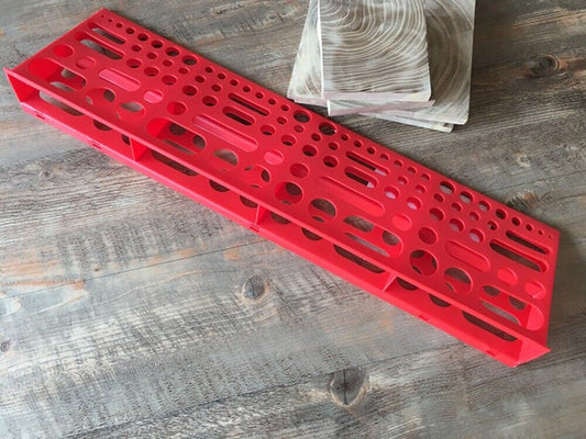 Wall-mounted hardware tool board, ideal for organizing screwdrivers and pliers in workshop spaces.