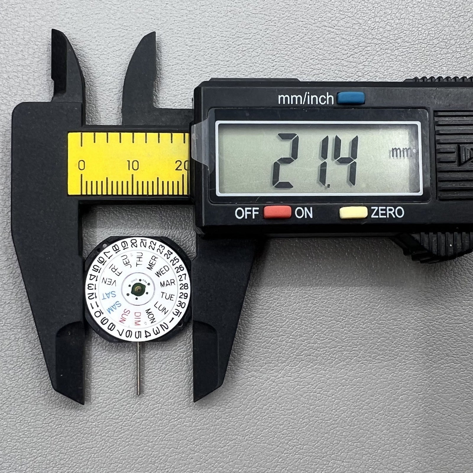 Japan Epson V733C quartz watch movement showing day and date display for accurate timekeeping.