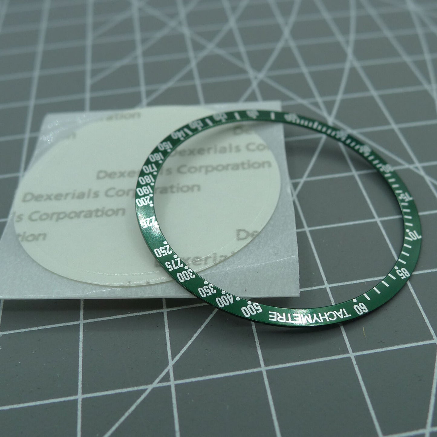 Green 38.5mm aluminum bezel with white font for Omega Speedmaster, enhancing watch durability and style.
