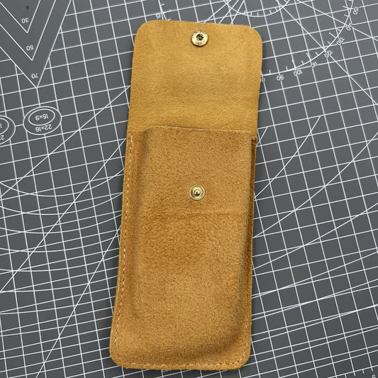 Brown Cowhide watch storage bag, portable travel pouch with soft lining for single watch protection.