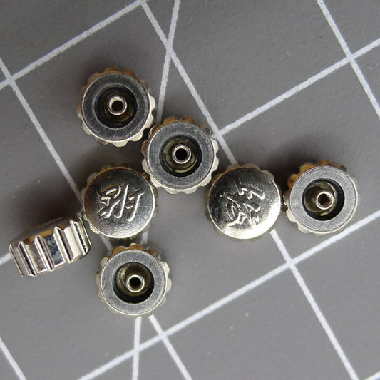 1. Set of 3 flat-shaped watch crowns with logo for Shanghai 7120 movement by Generic.