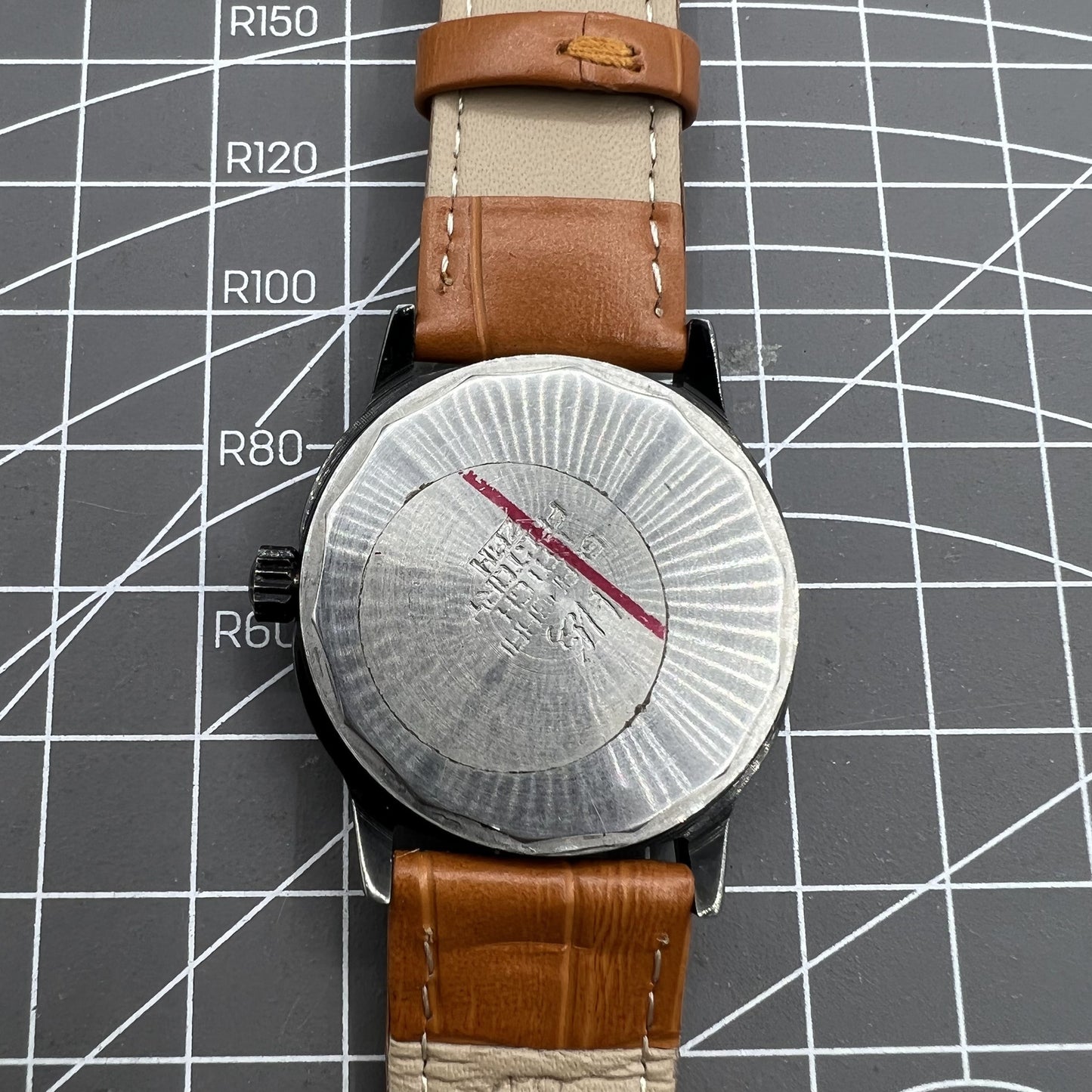 34mm Shanghai Factory manual mechanical watch with black dial, 19 jewels, shock-resistant for durable wear.