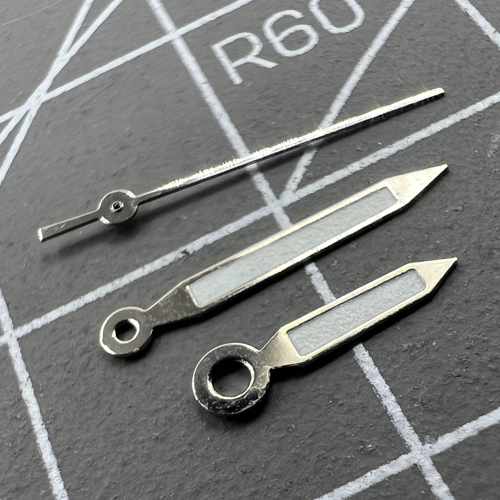 Silver-trimmed green lume arrow watch hands, 12mm, precision fit for Miyota 1M12 by BrandName.