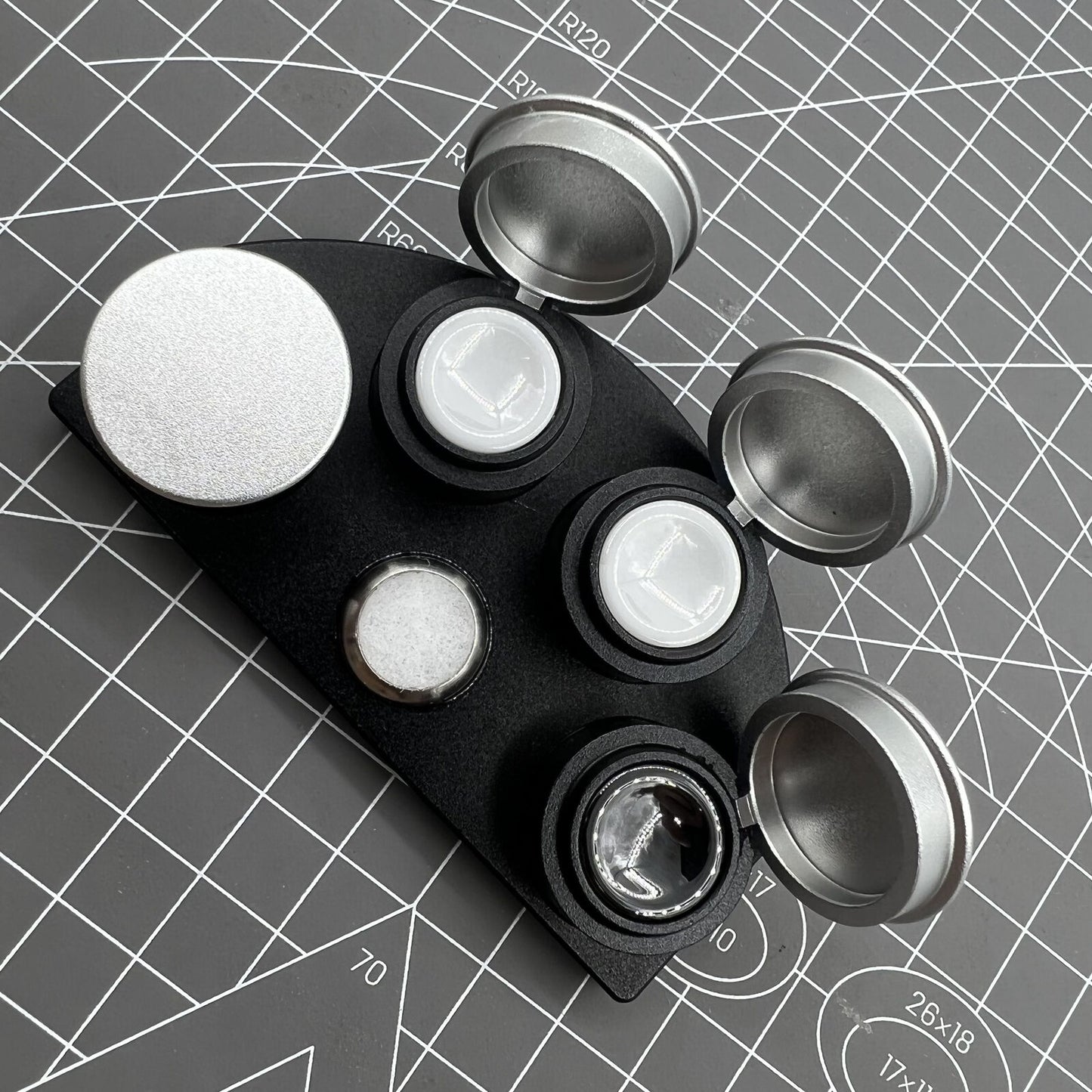 Die-cast alloy oil cup stand with 4 containers and black ceramic inserts for precise watch maintenance.