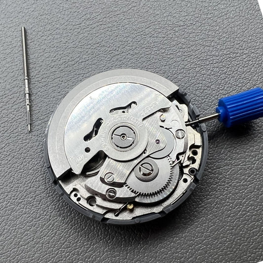 Japan NH35 vintage automatic watch movement with 24 jewels and black date wheel for precision timekeeping.