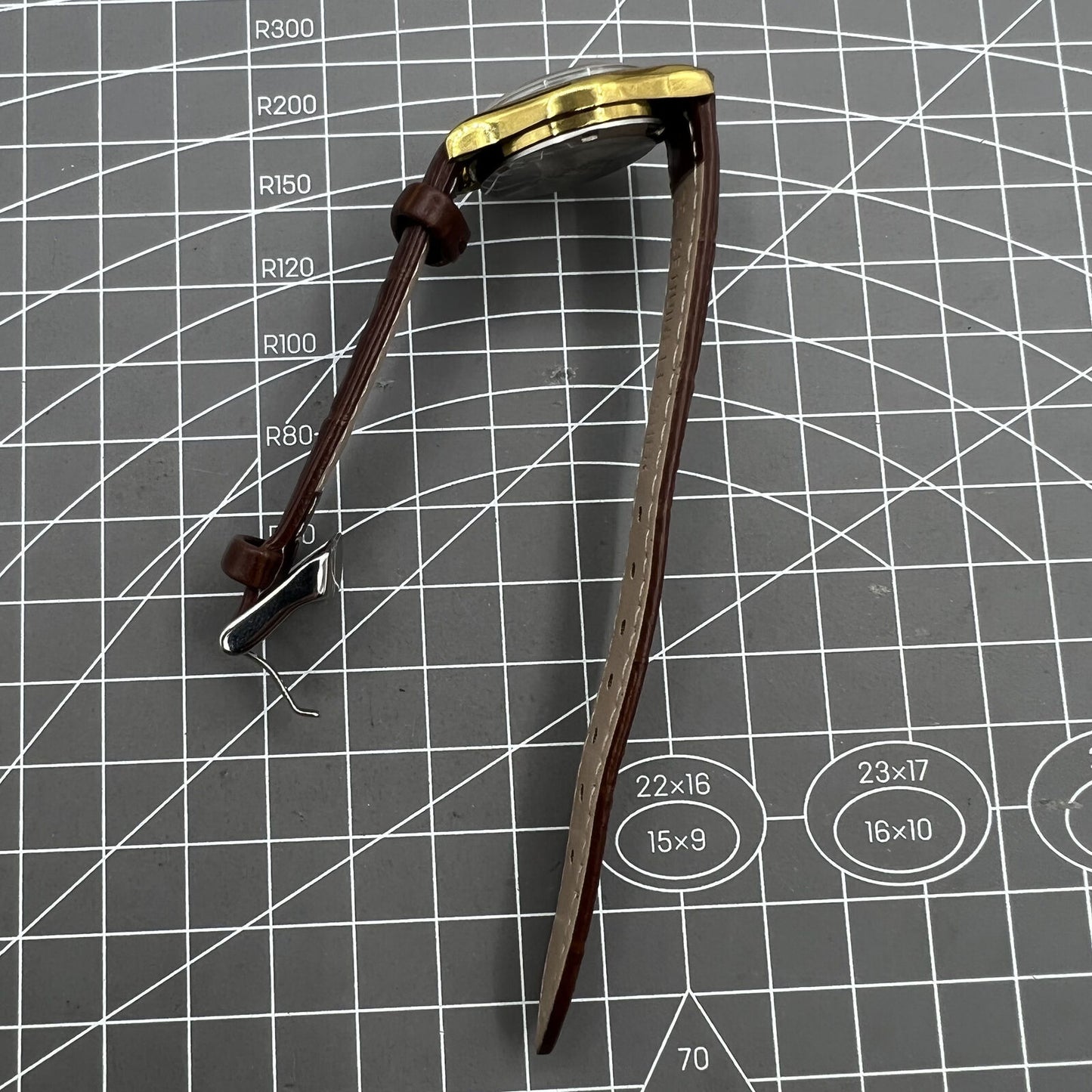 Brown 26mm Liaocheng TAISHAN manual mechanical lady watch with 19 jewels and gold nail accents, elegant design.