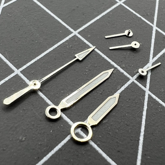 Silver trim green lume watch hands for ISA 8162/8172 quartz movements, precise fit and glow design.