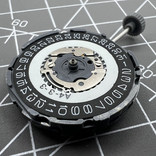 Miyota 6L76 black quartz watch movement disc, Japan-made, for precise timekeeping and repair.