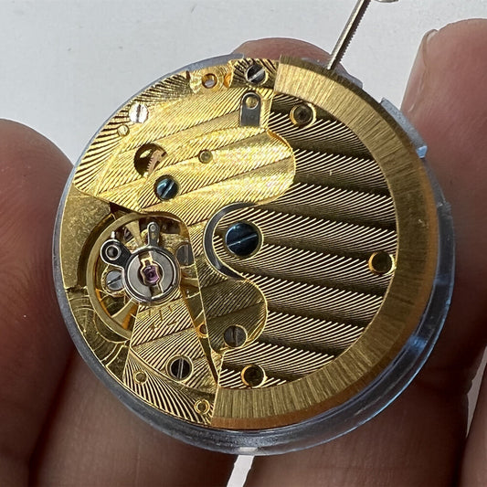 DG2813 automatic mechanical watch movement with hollowed-out design and single calendar display.