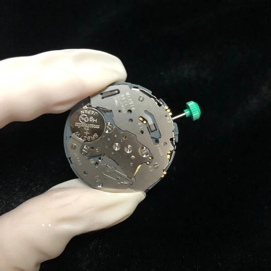 Miyota OS11 quartz watch movement with date display at 3, 4, and 6 o'clock positions for precise timekeeping.